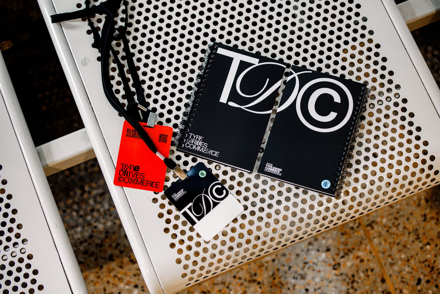 Red badge, lanyard and program booklet