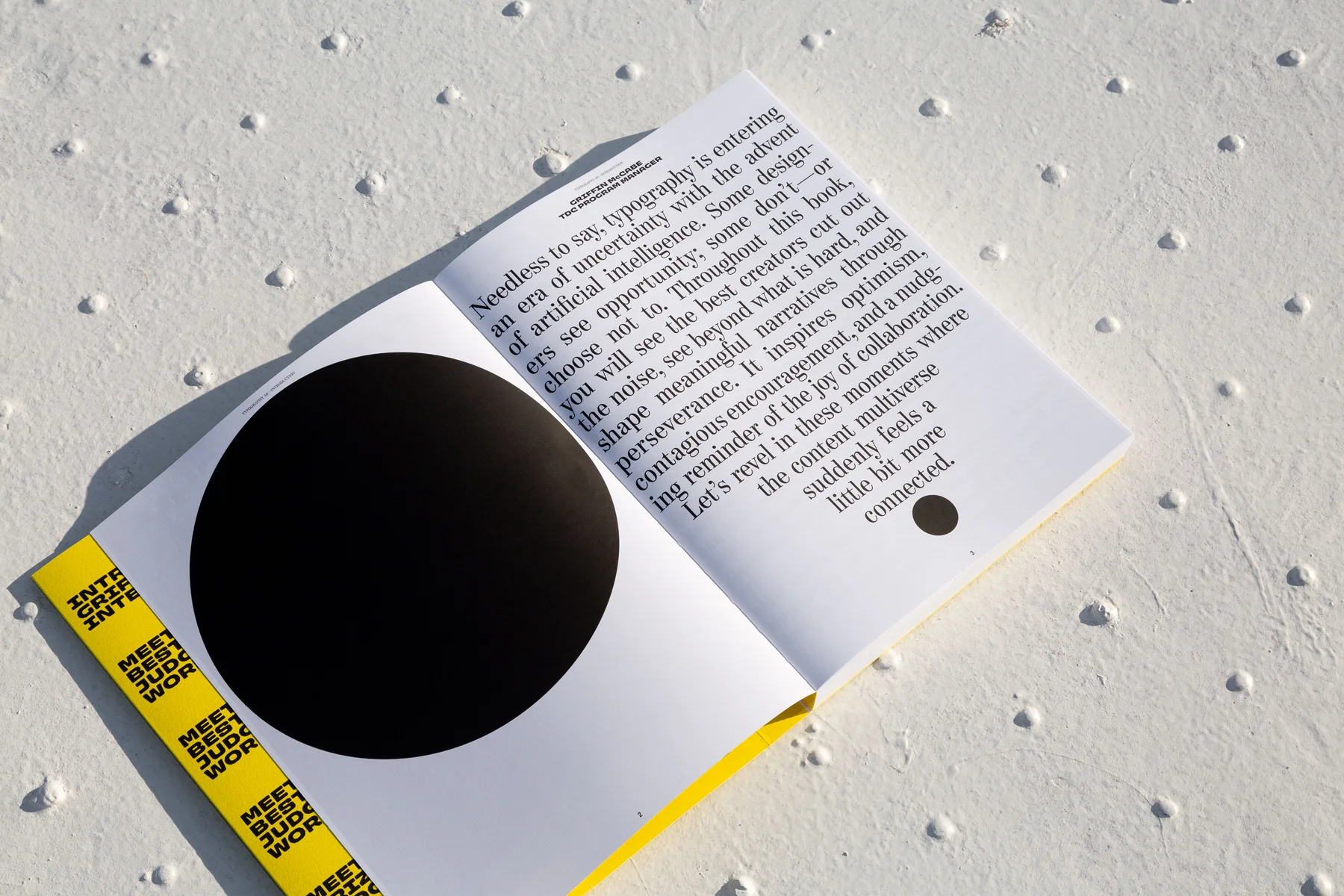 Typography 46 open, angled on a textured surface